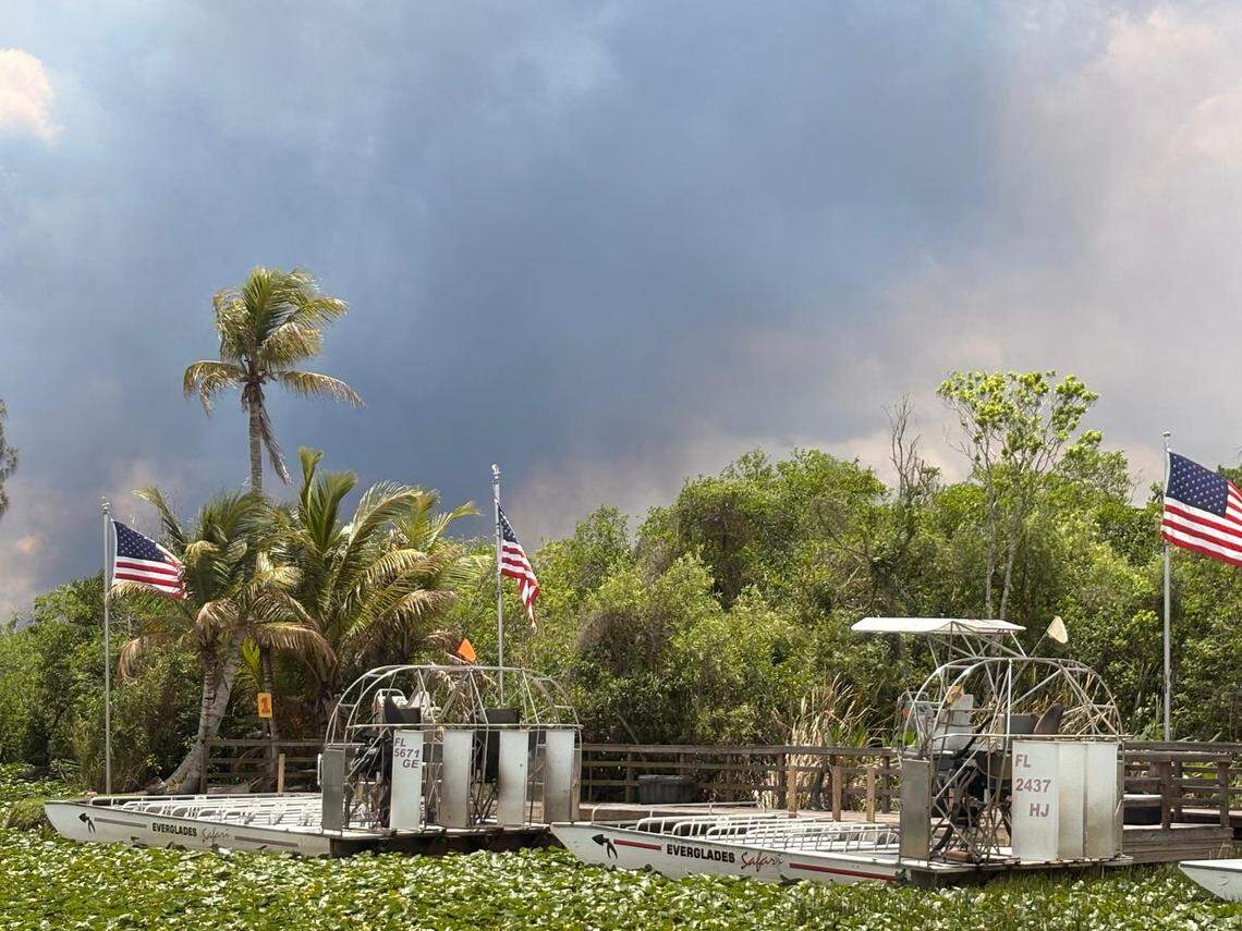 Federal and Miami-Dade County firefighters battled a large wildfire that has burned about 2,500 acres of the Florida Everglades.