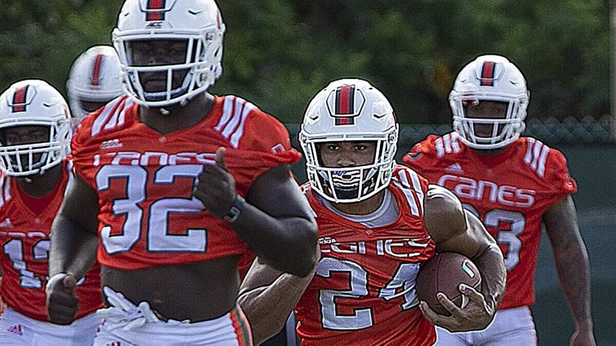 Senior running back Trayone Gray (32), shown next to starter Travis Homer (24) during the second day of University of Miami fall football camp on Sunday, August 5, 2018, is doing well, according to coach Mark Richt.