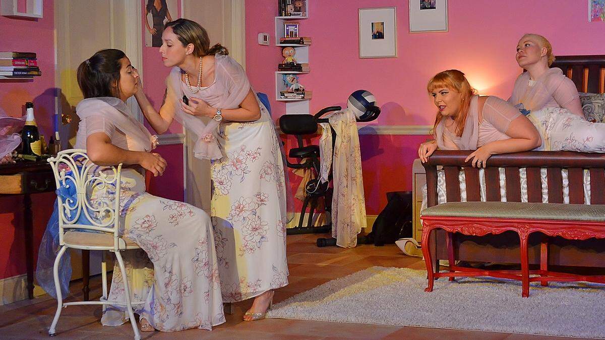 Icela Marliese gets a makeover from Amanda-Lynn Williams as Rei Capote and Thiana Berrick look on in Main Street Players’ “Five Women Wearing the Same Dress.”