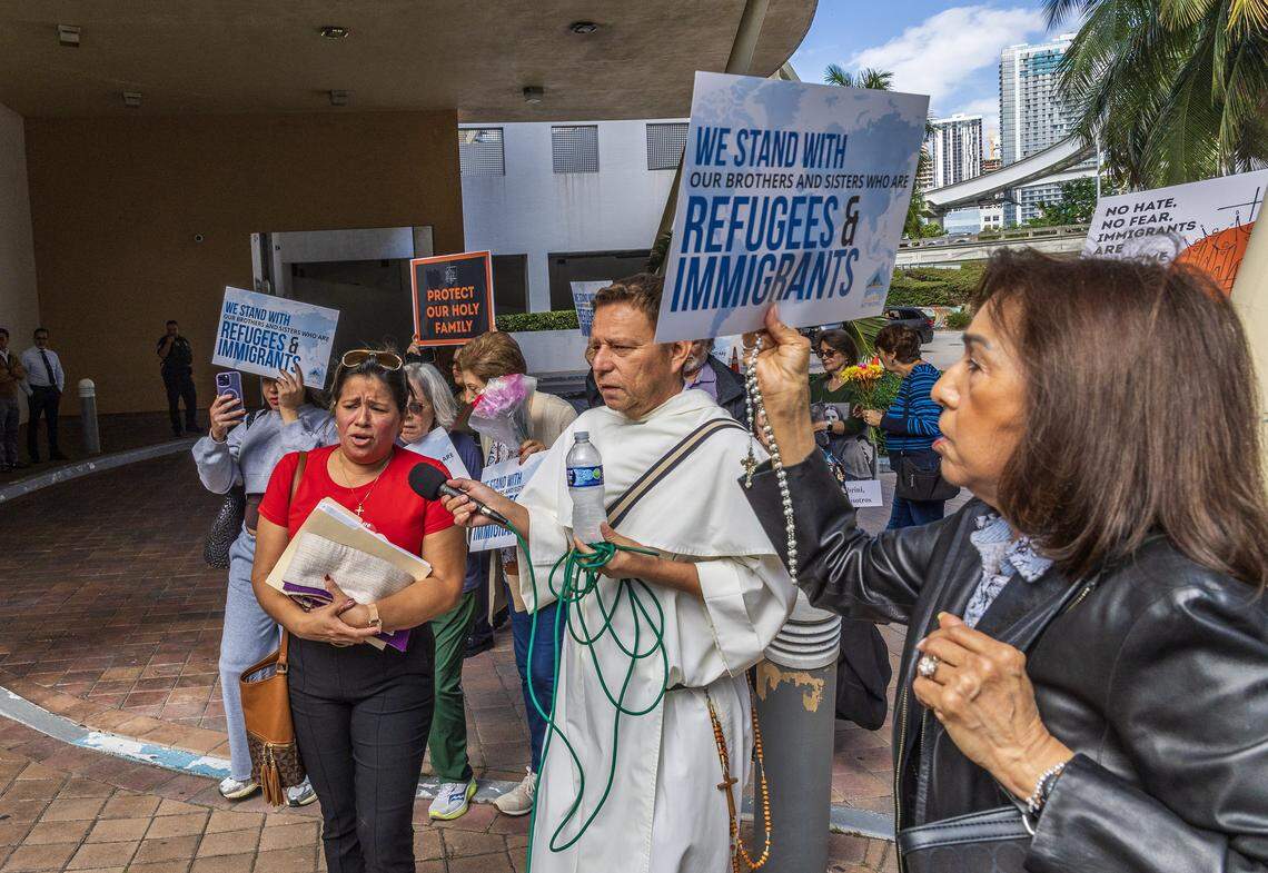 A group of immigrants advocates arrive in a procession to the EOIR Immigration Court, as part of the nationwide “One Church, One Family: Catholic Public Witness for Immigrants” campaign, on Thursday, November 13, 2025.