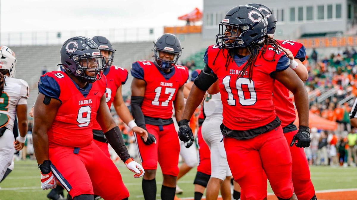Columbus Explorers Hector Chavez (10), Daylen Russell (9), and teammates react after Chavez scores against the Mandarin Mustangs in the first half during the Class 4M state championships at Bragg Memorial Stadium in Tallahassee, Florida, on Friday, December 8, 2023.