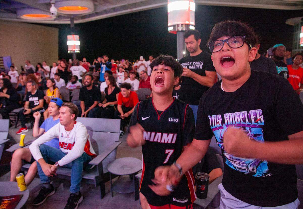 Brothers Juan Pablo (left), 10, and Fernando Mendoza (right), 13, chant, “Let’s go Heat!,” after the Heat chose Jaime Jaquez Jr.during the 2023 Miami Heat Draft Watch Party at Kaseya Stadium on Thursday, June 22, 2023 in Miami, Florida.