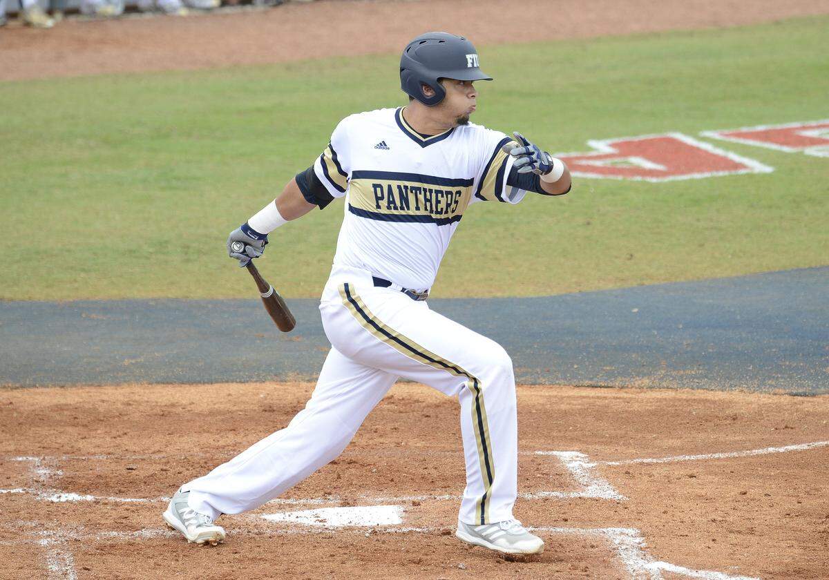 In 2014, Florida International University infielder Edwin Rios (28) plays against Rutgers University.