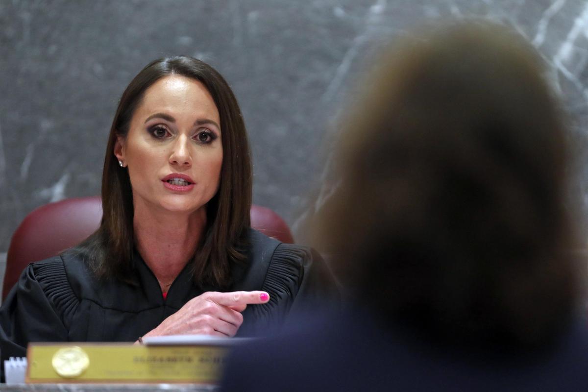 Broward Circuit Judge Elizabeth Scherer speaks to an attorney in August 2018 about Nikolas Cruz’s education record at the Broward County Courthouse in Fort Lauderdale.