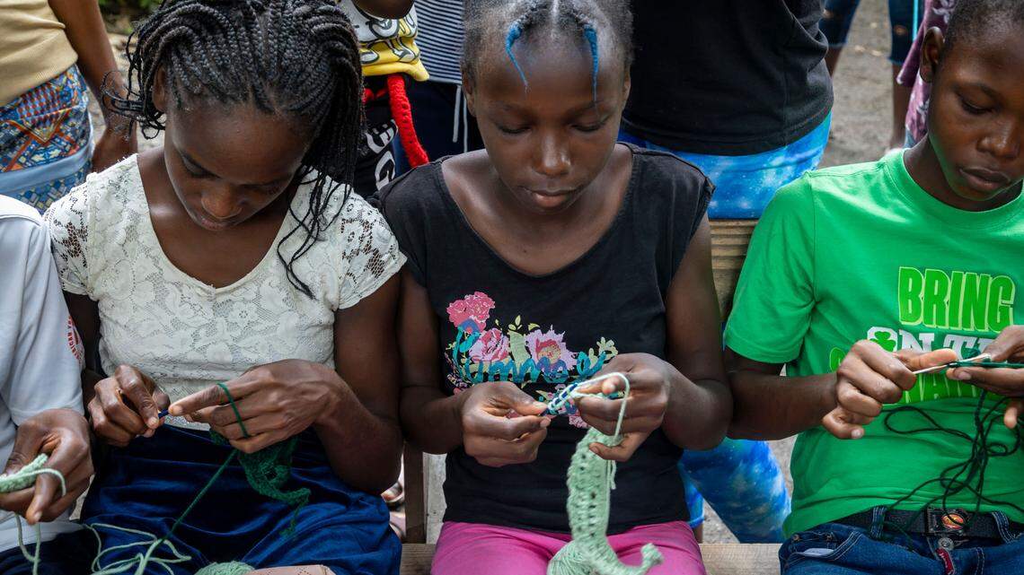 Leogane, Haiti, August 24 2024 - Children work on arts and crafts projects at a camp for displaced people in Leogane
