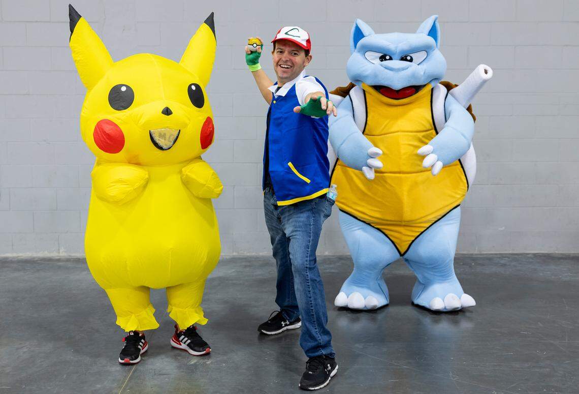 From left to right: Xander Iturbe, 10, as Pikachu, Shane Fernandez, 35, as Ash Ketchum, and Brad Burkhardt, 27, as Blastoise, cosplay as characters from Pokémon during Florida Supercon 2024 at the Miami Beach Convention Center on Saturday, July 13, 2024, in Miami Beach, Fla.