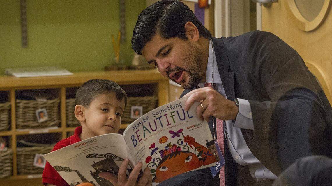 United Way of Miami Dade Young Leader Marcel Laniado, a banker from J.P. Morgan, reads to Marco, 4, at the Jumpstart Read for the Red, an international program where people around the world read the same book, on the same day, to children. This year, the group read ‘Maybe Something Beautiful: How Art Transformed a Neighborhood,” by F. Isabel Campoy and Theresa Howell on Thursday, October 25, 2018.