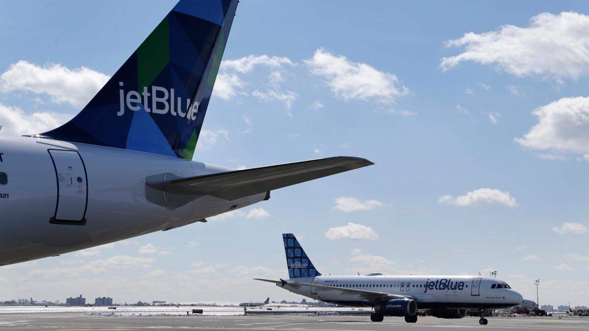 JetBlue opens new office in Dania Beach on Aug. 20 to focus on vacation packages. In this March 16, 2017, file photo, Jet Blue airplanes stand on the tarmac at John F. Kennedy International Airport in New York.