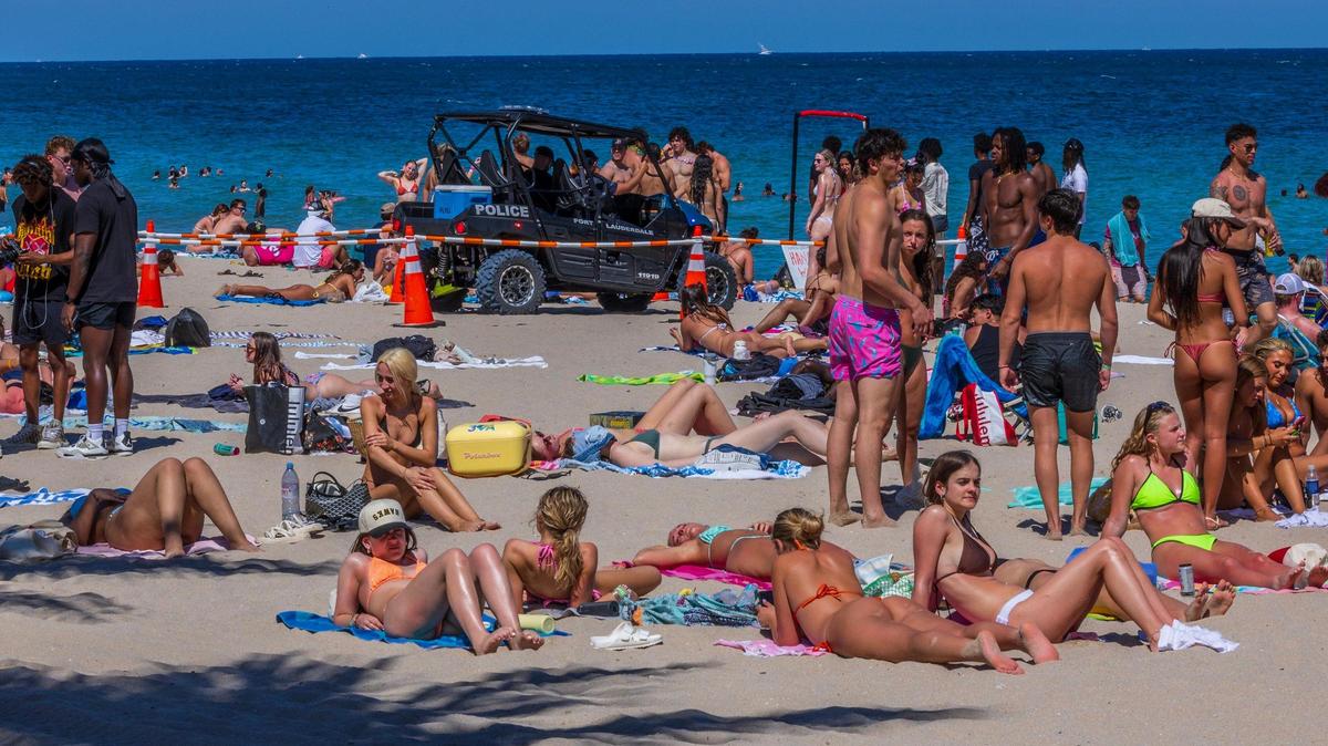 Police officers seen as spring breakers enjoy the nice weather at Fort Lauderdale Beach.