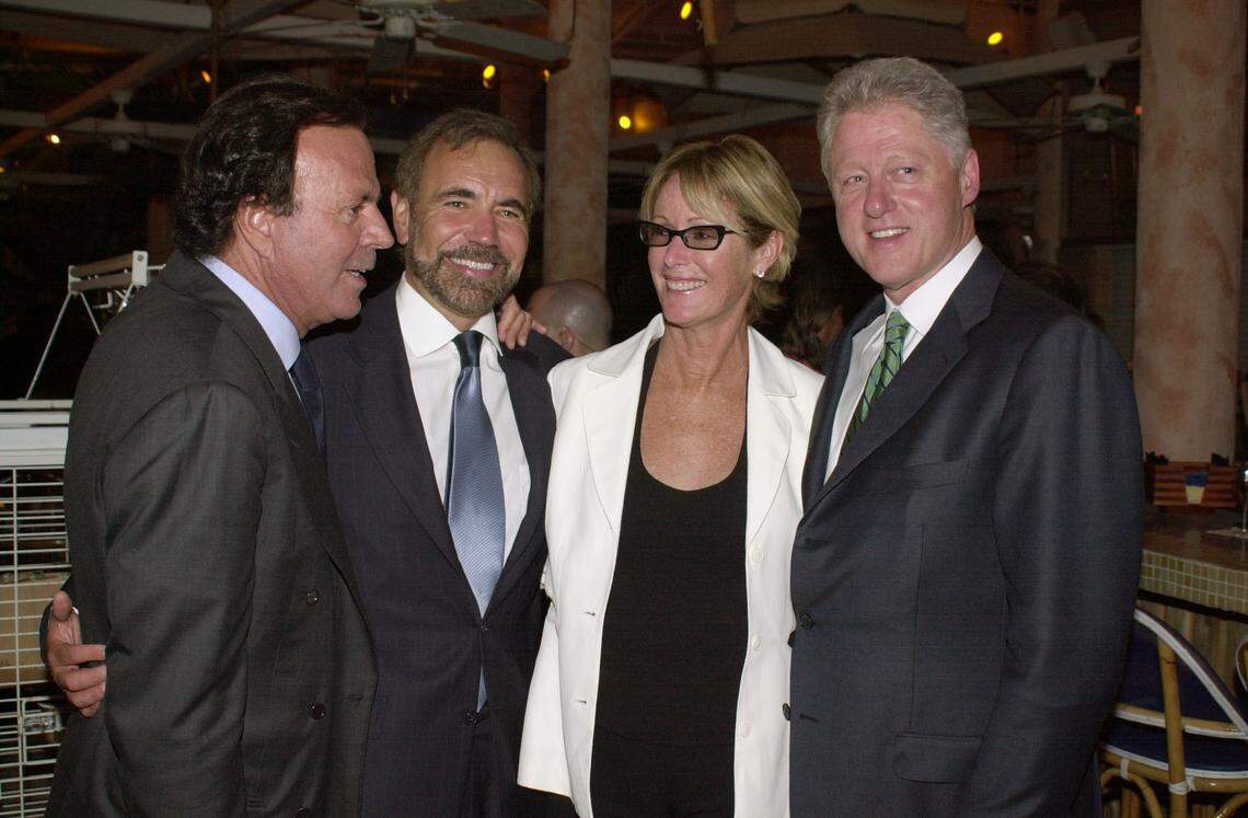 Michele Pommier at La Piaggia in South Beach with Julio Iglesias, Jorge Perez and President Bill Clinton in a file photo from April 16, 2003.