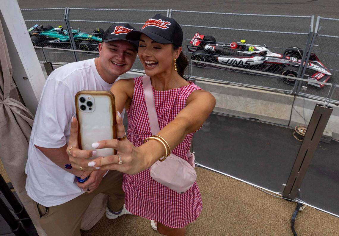 Reece Weaver, 23, left, and Will Amon, 24, right, take a selfie from The Beach Club inside Miami International Autodrome during Formula One Miami Grand Prix at the Miami International Autodrome on Sunday, May 4, 2025, in Miami Gardens, Fla.