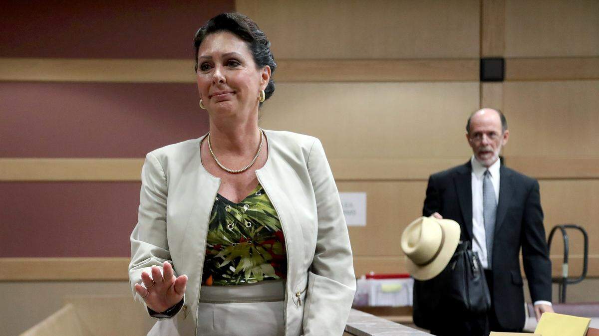 Former Hallandale Beach mayor Joy Cooper and her attorney, Larry Davis, leave court after a hearing at the Broward County Courthouse in Fort Lauderdale on Tuesday, Sept. 18, 2018.