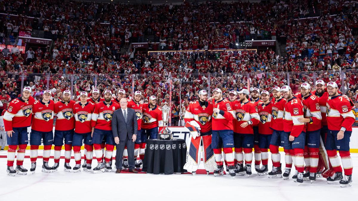 The Florida Panthers gather for a photo with Bill Daly, deputy commissioner of the NHL, and the Prince of Wales trophy after defeating the New York Rangers in Game 6 of the Eastern Conference finals of the NHL hockey Stanley Cup playoffs at the Amerant Bank Arena on Saturday, June 1, 2024, in Sunrise, Fla.