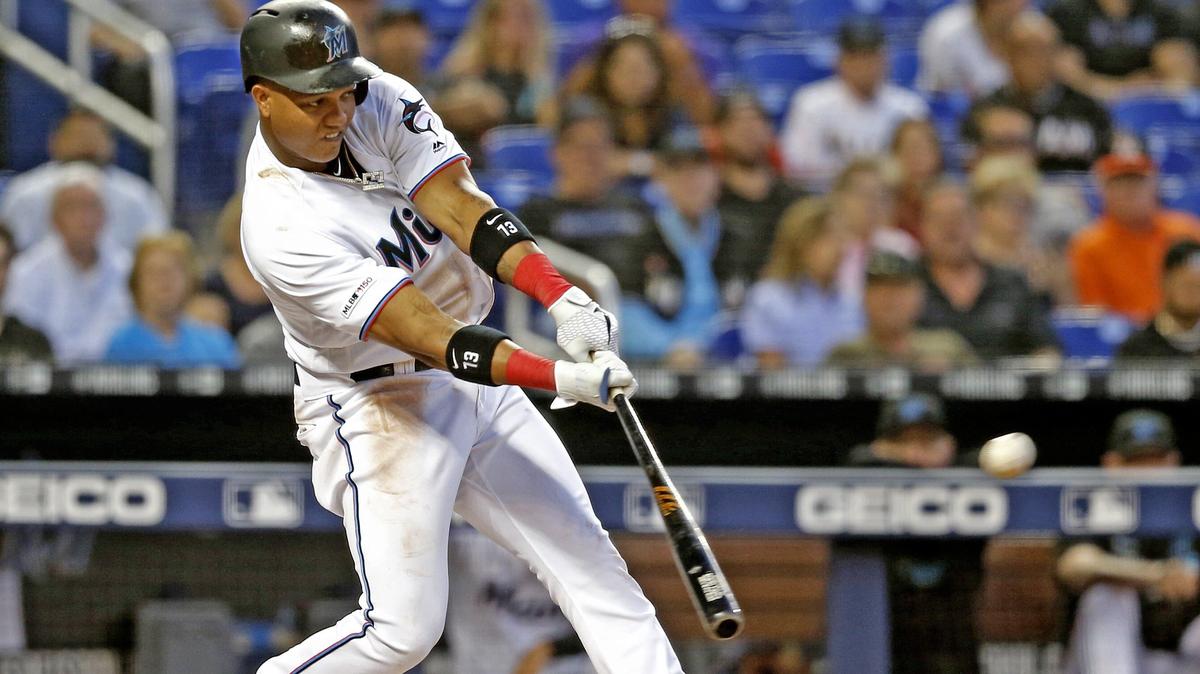 Miami Marlins second baseman Starlin Castro (13) hits a double and brings in two to score in the third inning. Castro made it to third base on an error by San Francisco Giants center fielder Steven Duggar (6) as the Miami Marlins host the San Francisco Giants at Marlins Park in Miami on Tuesday, May 28, 2019.
