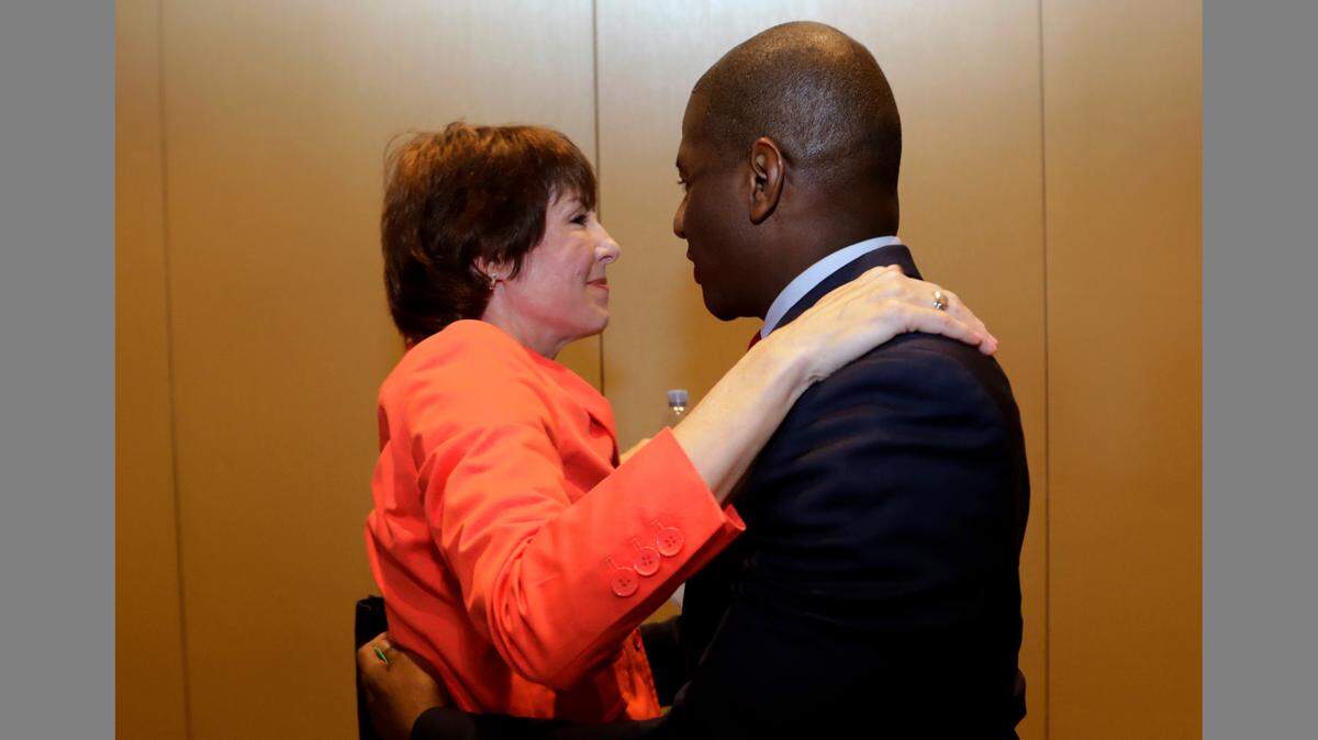 Democratic gubernatorial candidates Gwen Graham, left, and Andrew Gillum embrace during a candidates forum hosted by the Florida League of Cities, Wednesday, Aug. 15, 2018, in Hollywood.
