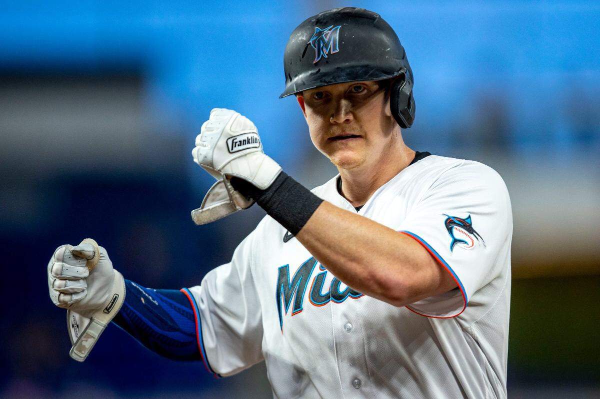 Miami Marlins base runner Garrett Cooper (26) reacts to hitting a single on a line drive during the first inning of an MLB game against the Washington Nationals at loanDepot park in the Little Havana neighborhood of Miami, Florida, on Wednesday, June 8, 2022.