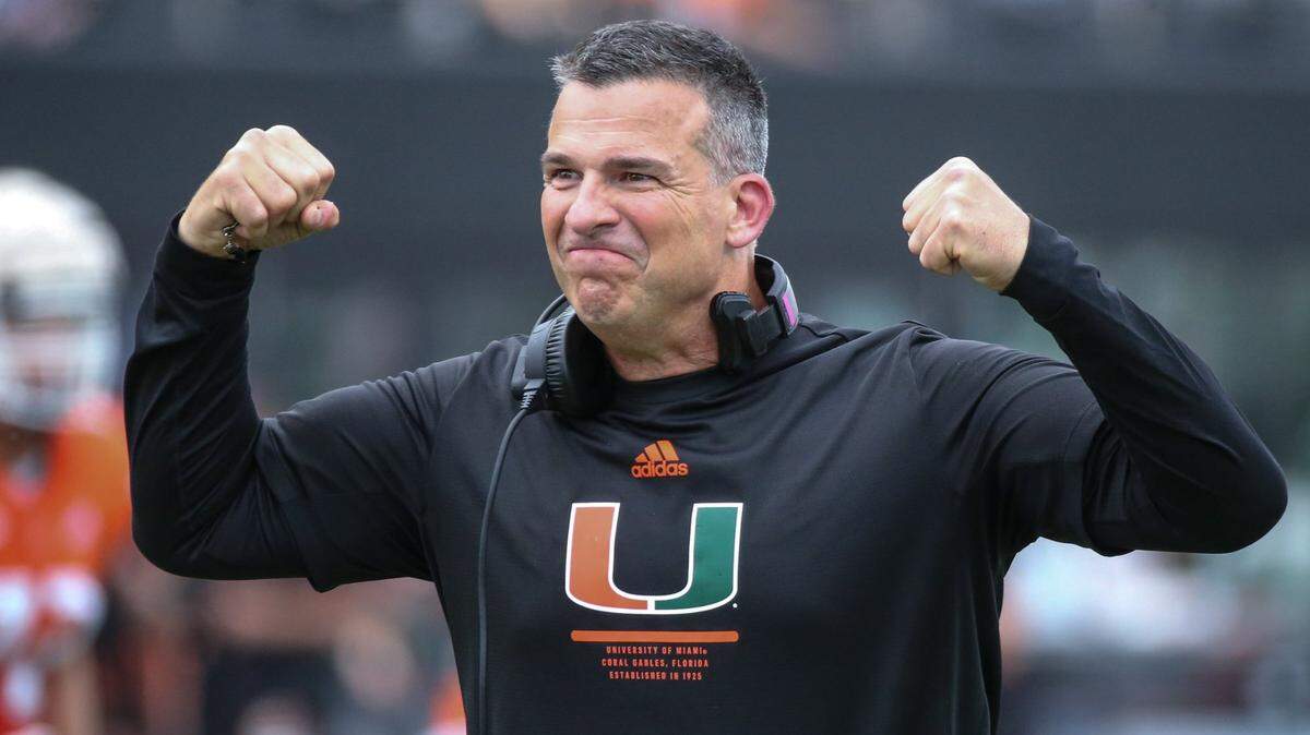Miami Hurricanes head coach Mario Cristobal flexes during the spring game for the University of Miami at DRV PNK Stadium in Fort Lauderdale, Florida on Saturday, April 16, 2022.