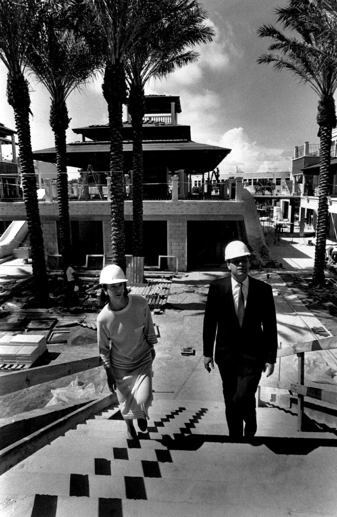 Executives walk through through CocoWalk under construction in 1990.