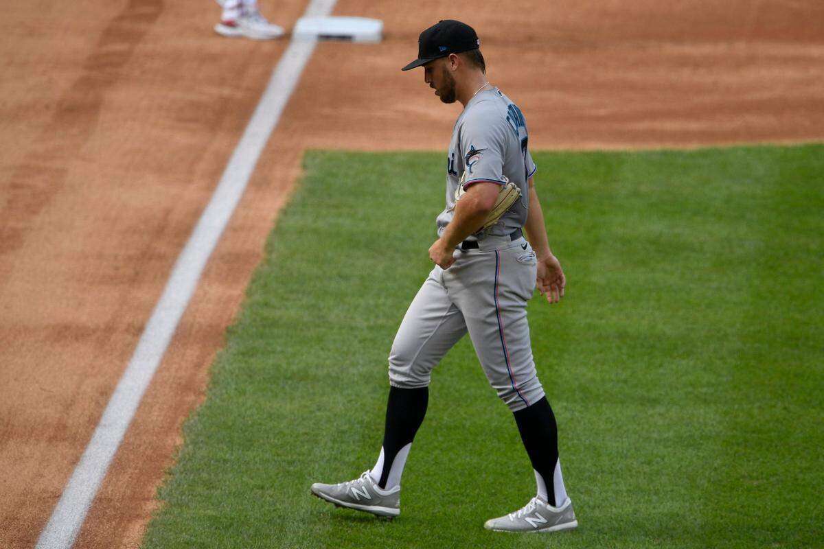 Miami Marlins starting pitcher Daniel Castano walks to the dugout after he was pulled during the first inning of the first baseball game of a doubleheader against the Washington Nationals, Saturday, Aug. 22, 2020, in Washington.