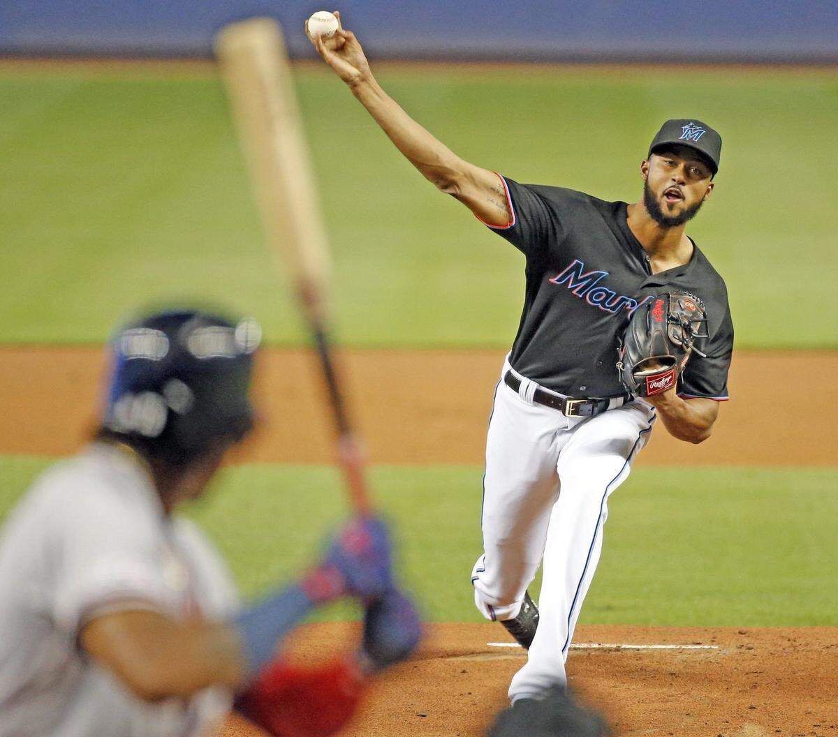 Miami Marlins starting pitcher Sandy Alcantara (22) pitches to Atlanta Braves center fielder Ronald Acuna Jr. (13) in the first inning as the Miami Marlins host the Atlanta Braves at Marlins Park in Miami on Saturday, August 10, 2019.