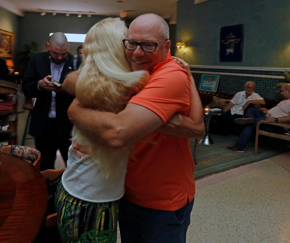 David Richardson, winning candidate for Miami Beach City Commissioner, Group 6, hugs supporter Sunny Weber as results came in.