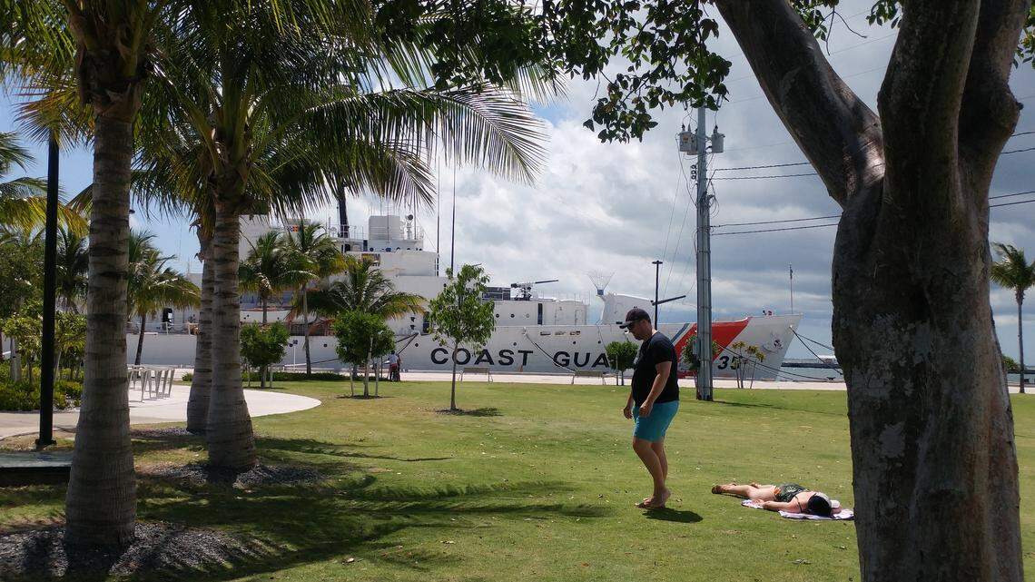 A couple relaxes at the city-owned Truman Waterfront Park, where the city will no longer use herbicides that contain glyphosate.