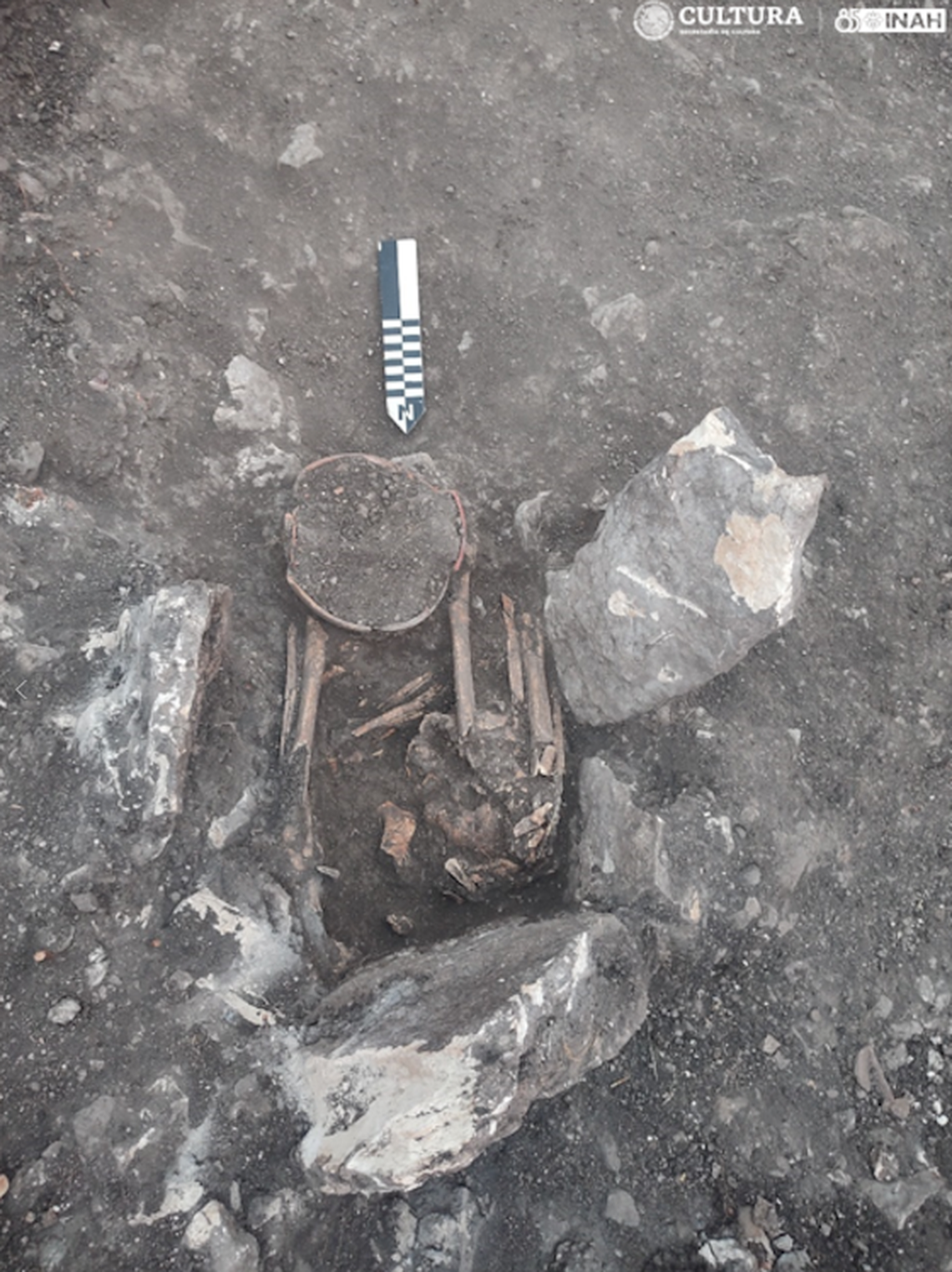 Some burials were found surrounded by rough rocks that made a sort of coffin, researchers said.