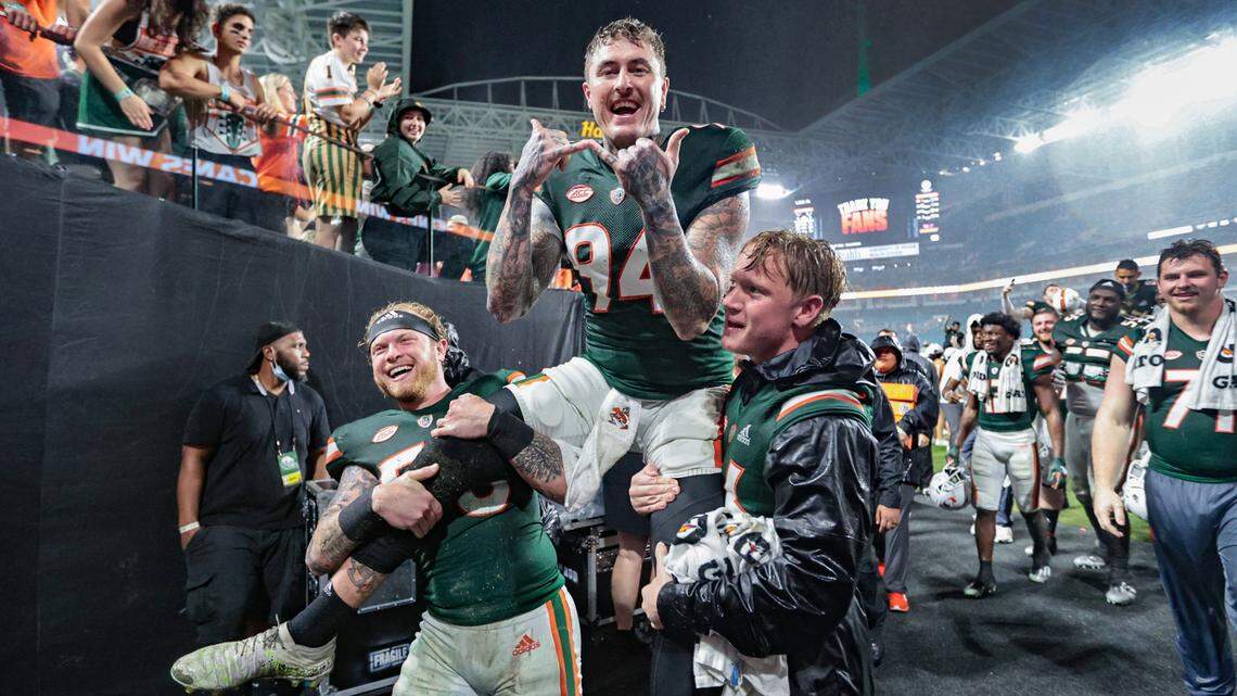 Miami Hurricanes punter Lou Hedley (94) is carried by teammates after the Canes defeat the Virginia Tech Hokies at Hard Rock Stadium in Miami Gardens on Saturday, November 20, 2021
