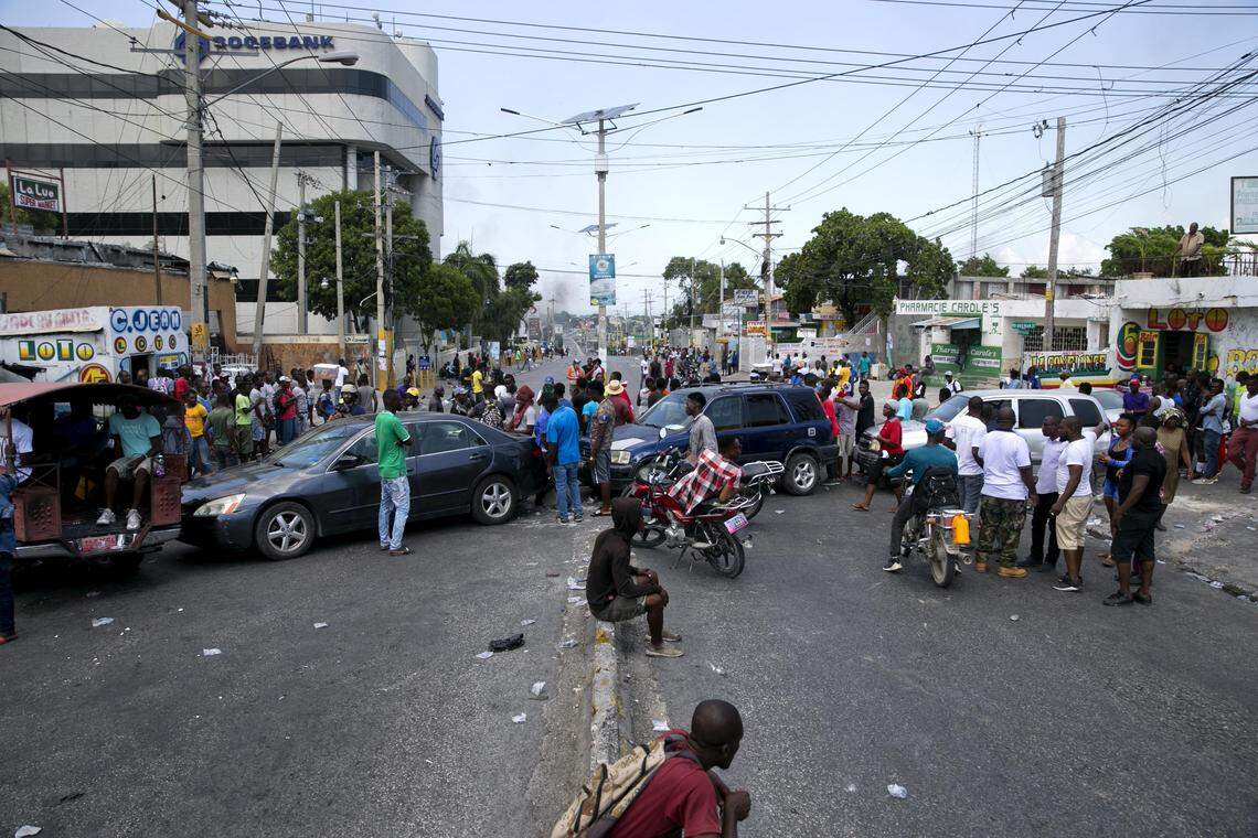 Residents block a street with their cars to protest fuel shortages in Port-au-Prince, Haiti, Monday, Sept. 16, 2019. Haiti was at a standstill with no public transportation available and banks, government offices, and schools closed amid street protests due to a fuel crisis.