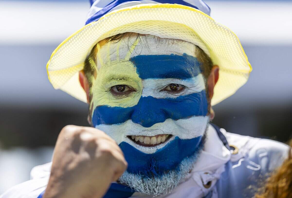 Hernan Mesa, an Uruguay fan, reacts as he arrives to Hard Rock Stadium before his team's World Cup Group H soccer match against Cape Verde on Sunday, June 21, 2026, in Miami Gardens, Fla.