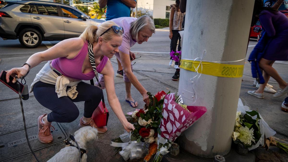 Natalie Goldsmith, left, leaves her Valentine’s Day Bouquet at a makeshift memorial in the corner of Biscayne Blvd and Northeast 22nd Street to pay respect to Jaklin Sabag, a 33-year-old mother who was killed in a crash while pushing her 8-month-old boy in a stroller across Biscayne Boulevard in Miami, Florida, on Wednesday, Feb. 14, 2024.