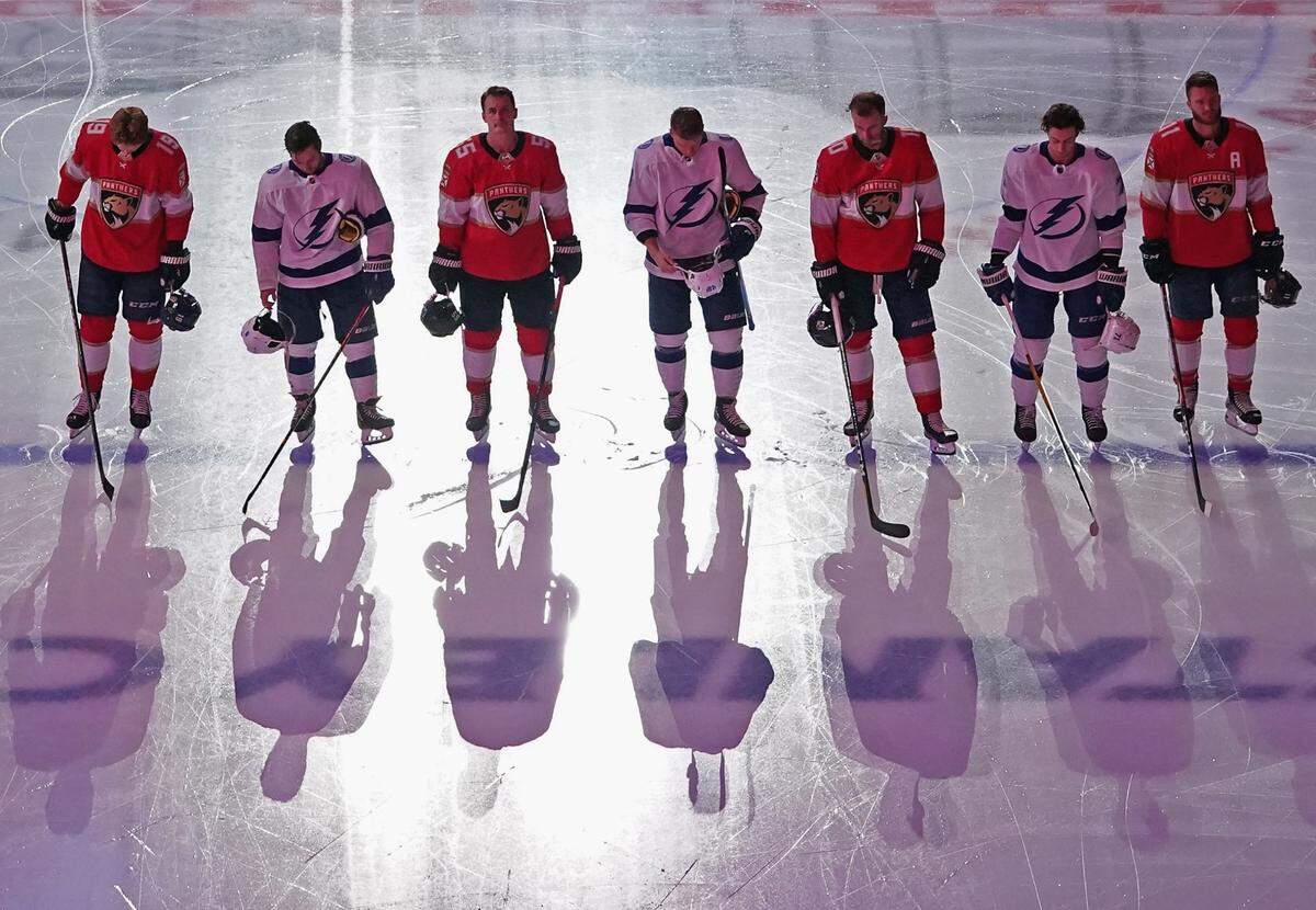 TORONTO, ONTARIO - JULY 29: The Tampa Bay Lightning and the Florida Panthers stand at attention for the national anthems prior to their exhibition game before the 2020 NHL Stanley Cup Playoffs at Scotiabank Arena on July 29, 2020 in Toronto, Ontario, Canada. (Photo by Andre Ringuette/Freestyle Photo/Getty Images)