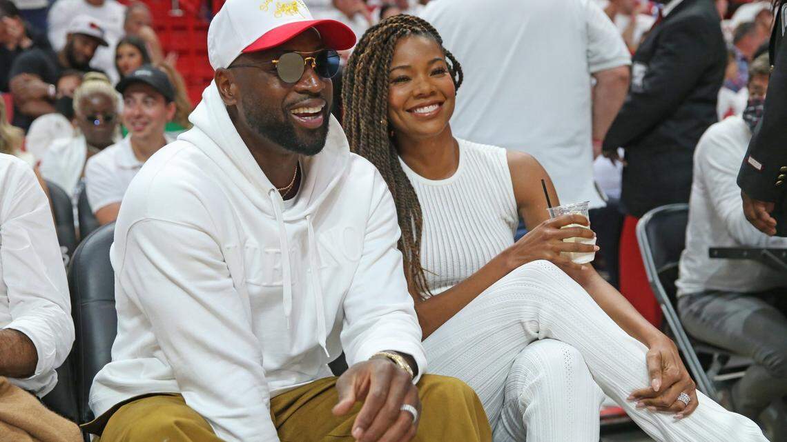 Dwyane Wade and his wife Gabrielle Union watch the game between the Miami Heat and Philadelphia 76ers during the NBA Playoffs, Round 2, Game 2 at FTX Arena in Miami on Wednesday, May 4, 2022.