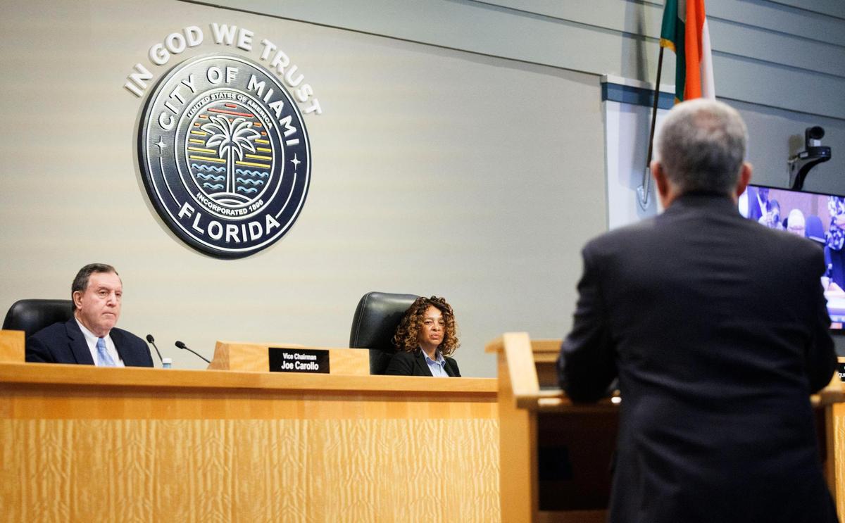 Vice Chairman Joe Carollo, left, and Chairwoman Christine King listen to public comment from someone who is against SR-1, legislation that cancels the November 2025 election and moves it to 2026, during a Miami City Commission meeting on Thursday, June 26, 2025, at Miami City Hall.