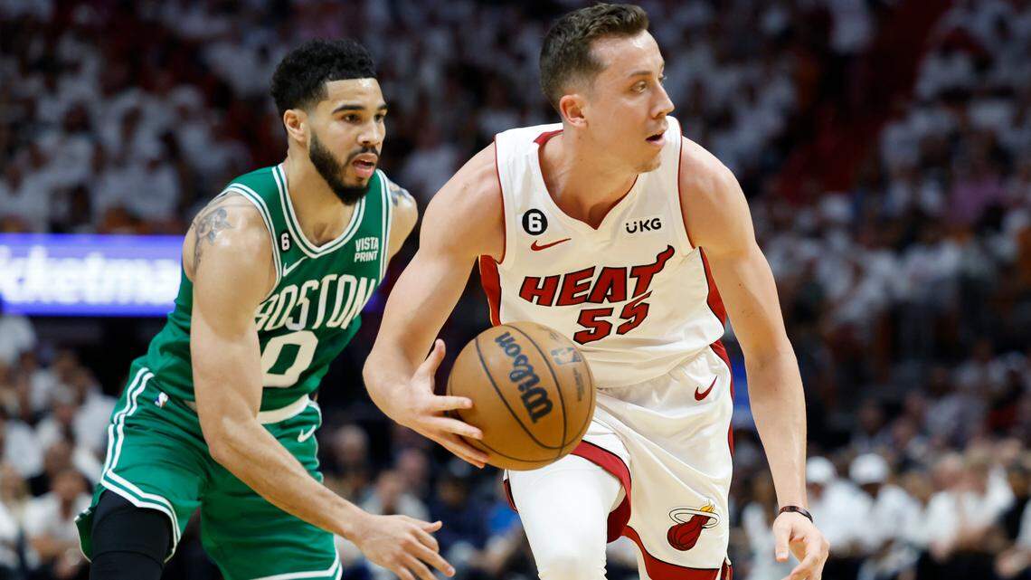 Miami Heat forward Duncan Robinson (55) drives the ball in the second quarter as Boston Celtics forward Jayson Tatum (0) gives chase in Game 4 of the NBA Eastern Conference Finals at the Kaseya Center in Miami on Tuesday, May 23, 2023.