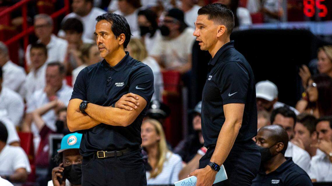 Miami Heat head coach Erik Spoelstra and assistant coach Chris Quinn watch their players from the sideline during the first half of Game 2 of the Eastern Conference finals against the Boston Celtics in Miami on May 19, 2022.