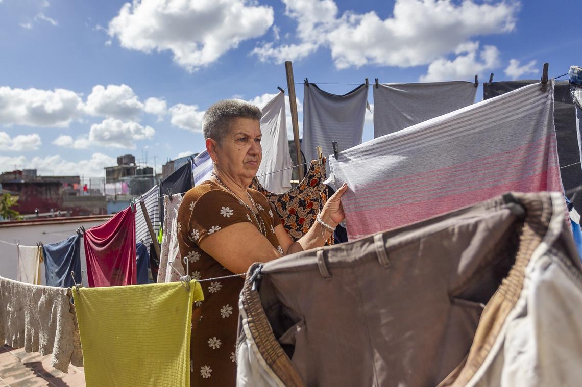Yolanda Paredes González, 66, does the laundry for participants at the Circulo de Abuelos in Old Havana.