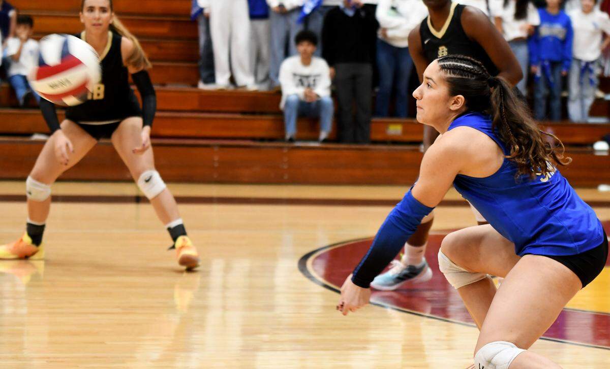 Divine Savior senior Luiza Bergamaschi completes a dig during a Class 2A state semifinals match against Tampa Prep on Monday at the FHSAA state tournament at Polk State College in Winter Haven.