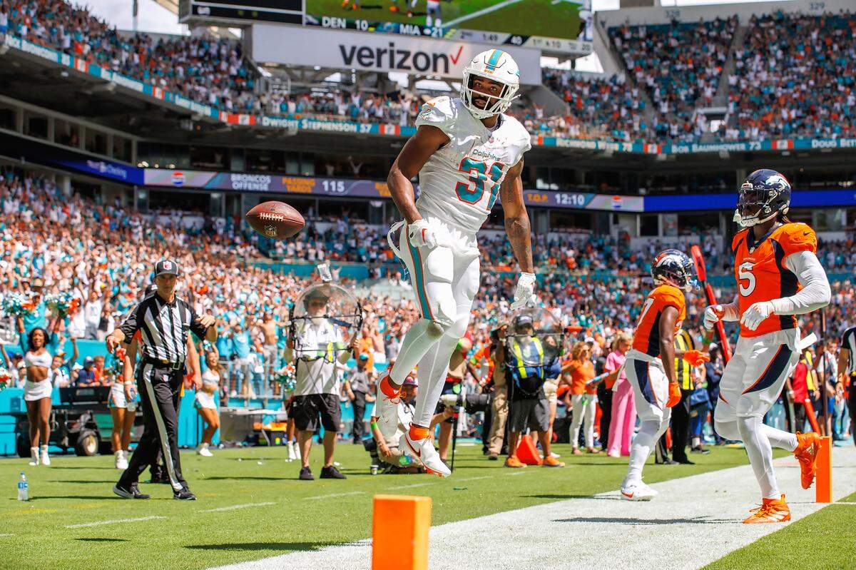 Miami Dolphins running back Raheem Mostert (31) reacts after scoring a touchdown against the Denver Broncos during second quarter of an NFL football game at Hard Rock Stadium on Sunday, Sept. 24, 2023 in Miami Gardens, Fl.