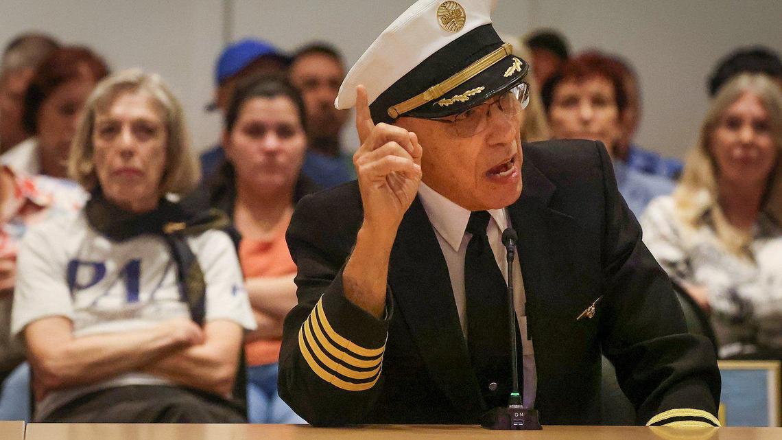 Former Pan Am Express pilot Armando Martinez wears his old uniform while asking the Miami-Dade County historic preservation board, meeting at the Miami-Dade Main Library, to designate a 1929 hangar built by airline founder Juan Trippe, the last standing original building at Miami International Airport, as a historic landmark. gives his remarks during the preservation board meeting. The Miami-Dade County Historic Preservation Board gathered on Wednesday, June 26, 2024, in Miami, Florida, to consider a petition to declare an old Pan American hangar at MIA, one of the airport’s original buildings and its oldest standing structure, a historic landmark at the Arva Parks McCabe Auditorium at Miami-Dade Main Library.