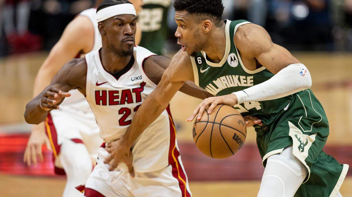 Milwaukee Bucks forward Giannis Antetokounmpo (34) drives the ball while Miami Heat forward Jimmy Butler (22) defends during the third quarter of Game 4 in the first-round NBA basketball playoff series at the Kaseya Center on Monday, April 24, 2023, in downtown Miami, Fla.