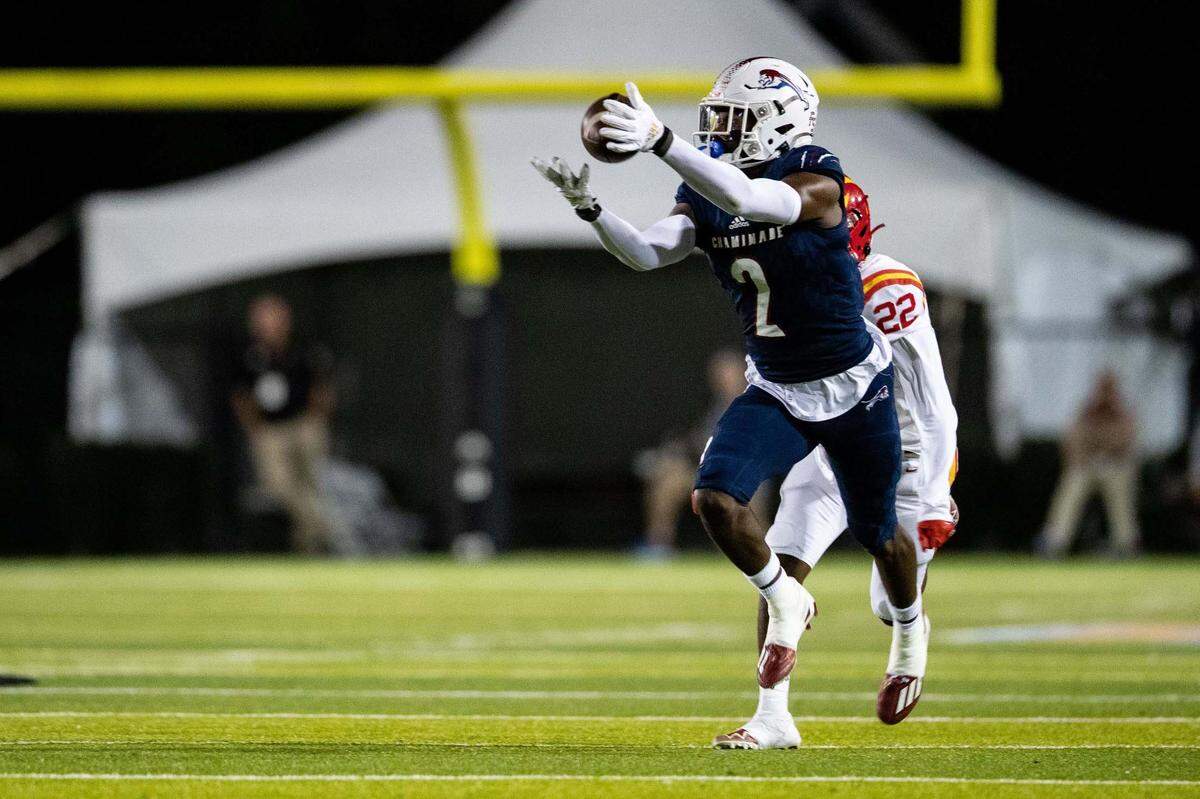 Chaminade wide receiver Edwin Joseph (2) catches a pass from quarterback Cedrick Bailey (11). The Chaminade Lions lead the Clearwater Central Catholic Marauders 28-0 at the half of the Class IM State Championship game at Gene Cox Stadium in Tallahassee, Florida on Thursday, Dec. 8, 2022.
