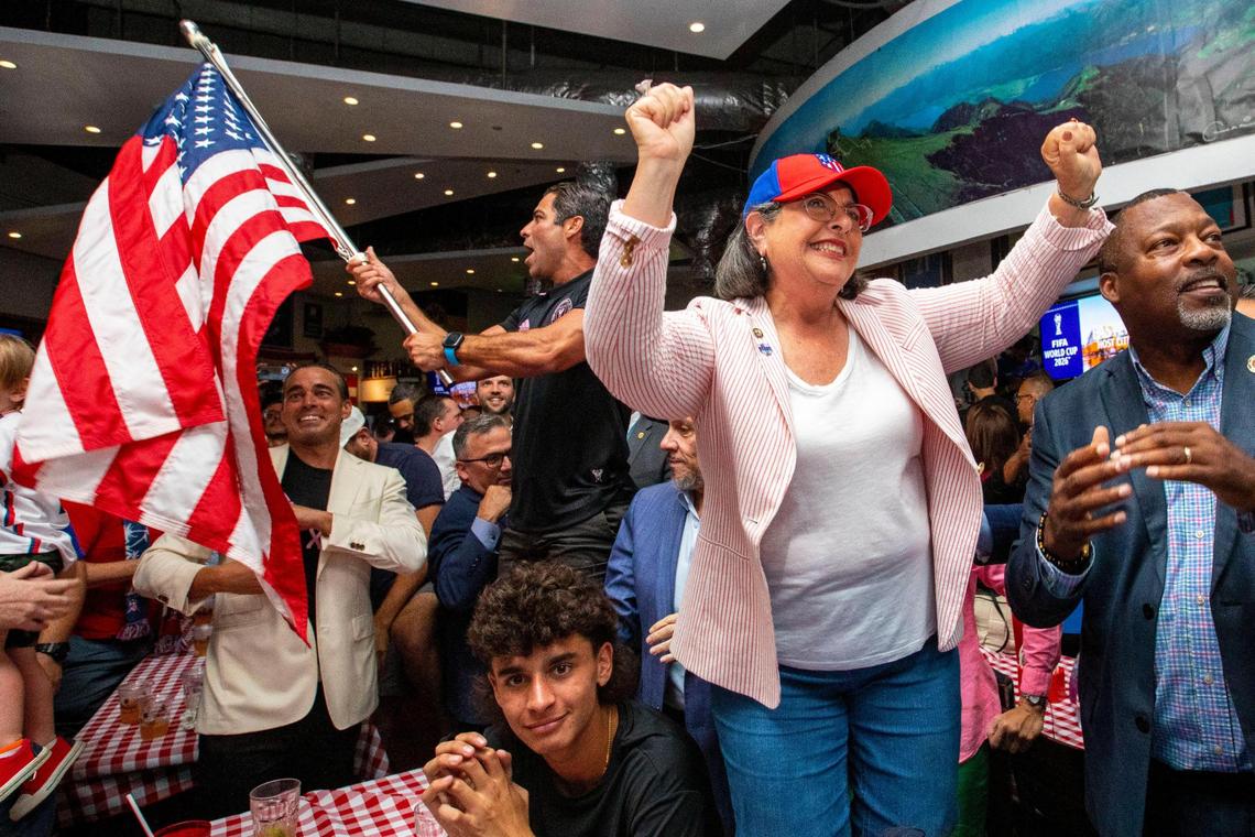 Mayor of Miami-Dade County Daniella Levine Cava, right, and Miami Mayor Francis Suarez, back left, react to Miami being selected as one of the cities for the FIFA 2026 World Cup venue during a watch party at Fritz & Franz Bierhaus in Coral Gables, Florida, on Thursday, June 16, 2022.
