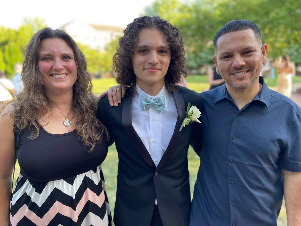 Carlos and Angela with their son Alessandro during his junior year high school homecoming in 2021