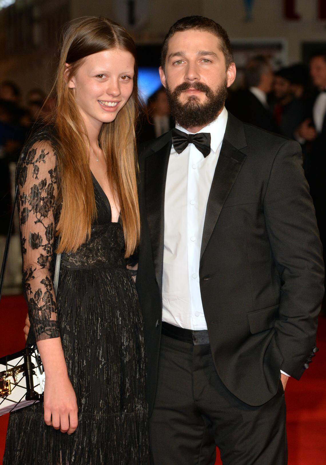 LONDON, ENGLAND - OCTOBER 19: Mia Goth and Shia LeBeouf attend the closing night European Premiere gala red carpet arrivals for "Fury" during the 58th BFI London Film Festival at Odeon Leicester Square on October 19, 2014 in London, England. (Photo by Anthony Harvey/Getty Images for BFI)