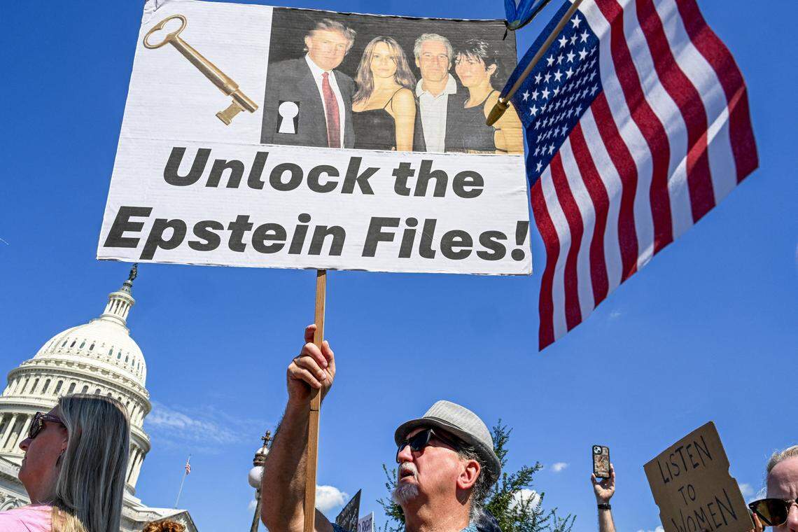 Demonstrators carry signs in support of the victims of sex offender Jeffrey Epstein and his accomplice Ghislaine Maxwell near a press conference held by US representatives outside the U.S. Capitol in Washington, DC, on September 3, 2025.         