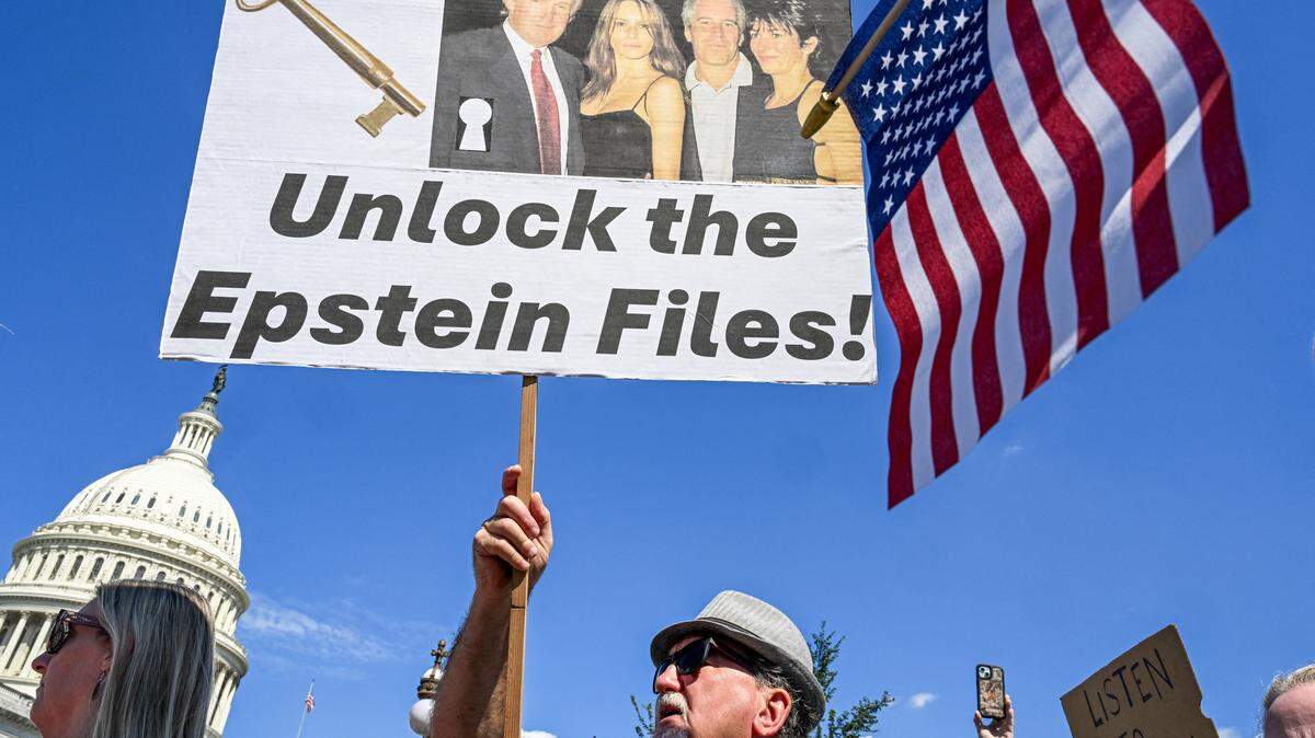 Demonstrators carry signs supporting victims of Jeffrey Epstein and his accomplice Ghislaine Maxwell outside the U.S. Capitol on Sept. 3, 2025, in Washington, DC.