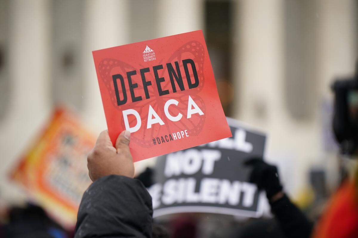 Immigration rights activists take part in a rally in front of the US Supreme Court in Washington, D.C., on November 12, 2019, when the U.S. Supreme Court hears arguments on the fate of the Dreamers, an estimated 700,000 people brought to the country illegally as children but allowed to stay and work under a program created by President Barack Obama known as Deferred Action for Childhood Arrivals or DACA.