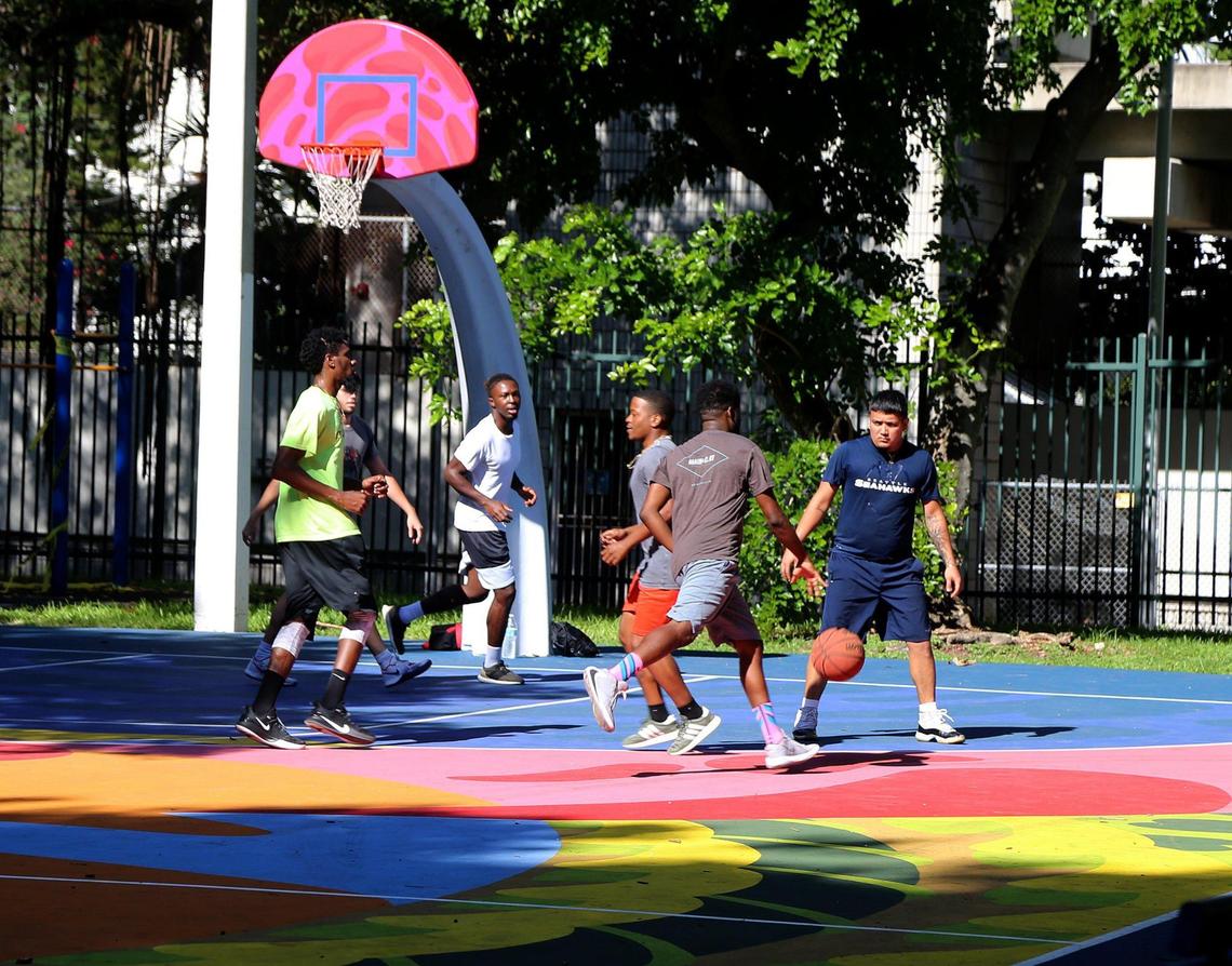 Basketball players use the popular court at Southside Park. Some Brickell-area residents are worried about overdevelopment and a proposed 62-story tower adjacent to the park, which could be closed and overtaken by construction equipment for two to three years.