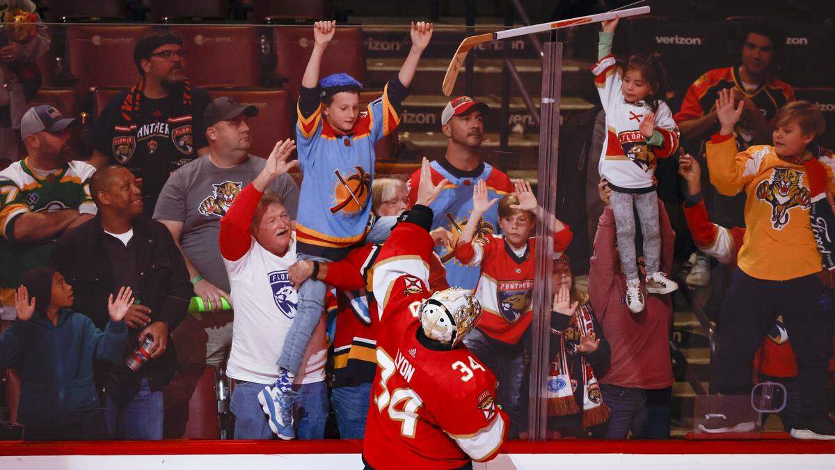 Florida Panthers goaltender Alex Lyon (34) gives away his hockey stick to fans after the Panthers defeat Minnesota Wild at FLA Live Arena in Sunrise, FL on Saturday, January 21, 2023.